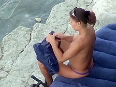 Hot girl pumping hard at the beach