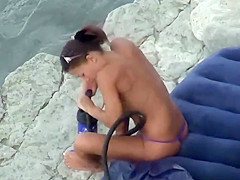 Hot girl pumping hard at the beach