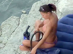 Hot girl pumping hard at the beach