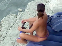 Hot girl pumping hard at the beach