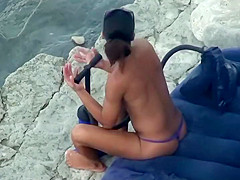 Hot girl pumping hard at the beach
