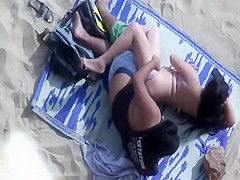 Spooning and fucking on the beach