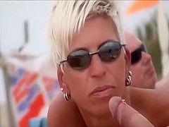 Short haired woman gives a blowjob