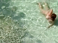 Gigantic fake tits of a topless babe