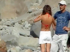 Skinny girl removes her bikini bottom