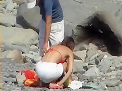 Skinny girl removes her bikini bottom