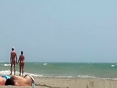 Voyeur at nudist beach secretly films women