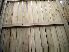 Woman changing in beach cabin