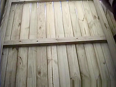 Woman changing in beach cabin