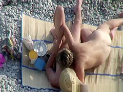 Mature nudist in husband's arms