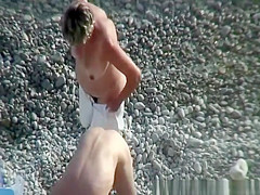 Mature nudist in husband's arms