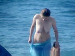 Topless Woman on the Beach