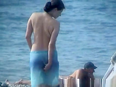 Topless Woman on the Beach