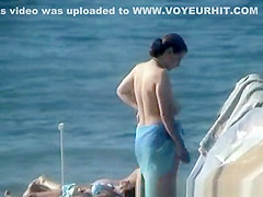 Topless Woman on the Beach