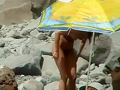 Couple trying to fuck on the beach