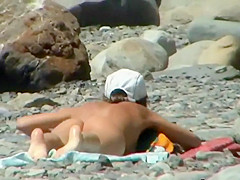 Couple trying to fuck on the beach