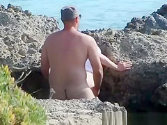 Sex by rocks on the beach