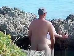 Sex by rocks on the beach