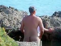 Sex by rocks on the beach