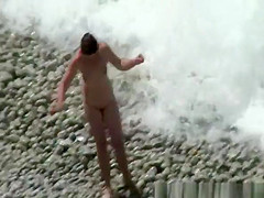 Small boobs nudist swimming in the water