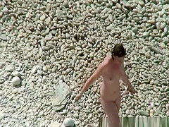 Small boobs nudist swimming in the water