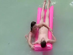 Small boobs nudist swimming in the water