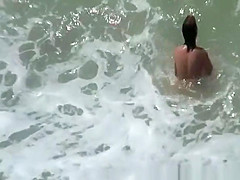 Small boobs nudist swimming in the water