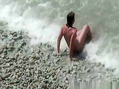 Small boobs nudist swimming in the water
