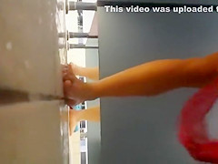 Athletic chick wipes off in a pool cabin