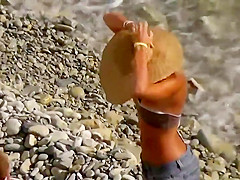 Perfect pale ass rides a dick on a beach