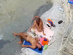 Spying foreplay and sex on the beach