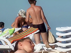 Topless chick eats an ice cream