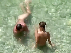 Hot teen girls cover friend with sand