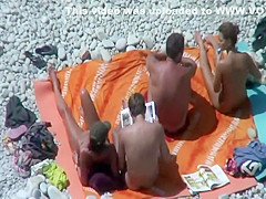 Hot teen girls cover friend with sand