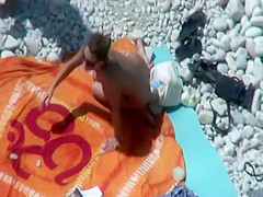 Hot teen girls cover friend with sand