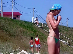 Passing by a nude girl on beach