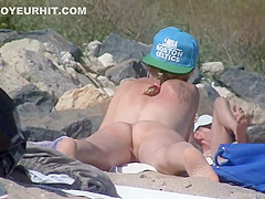 Passing by a nude girl on beach