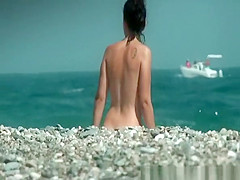 Nudist and topless women on the beach
