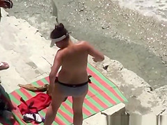 Nude woman refreshing in the water