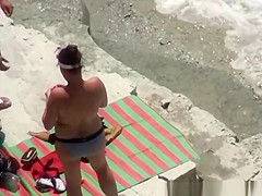 Nude woman refreshing in the water