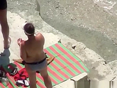 Nude woman refreshing in the water