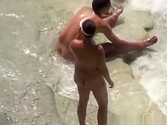 Nude woman refreshing in the water