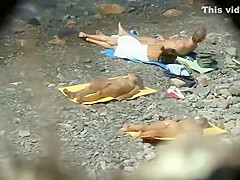 Skinny girl spied while lying on the beach