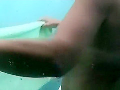 Mature woman spied in beach cabin showering