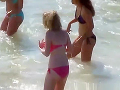 Big tits teen in red bikini at beach