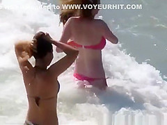 Big tits teen in red bikini at beach