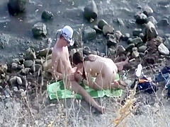 Horny guy gets a blowjob on the beach