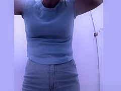 Woman changes bikini for bra and shorts