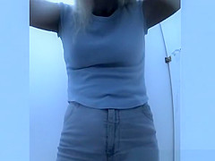 Woman changes bikini for bra and shorts