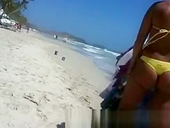 Woman with a big ass on the beach